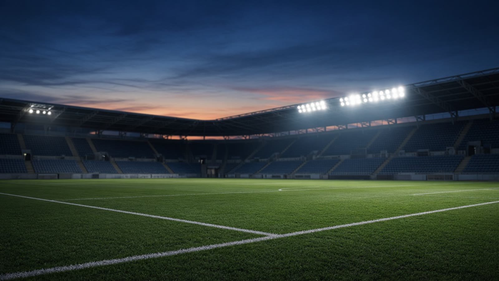 Tom fotbollsarena i skymning med strålkastarljus över planen — atmosfär inför Nations League-landskamp