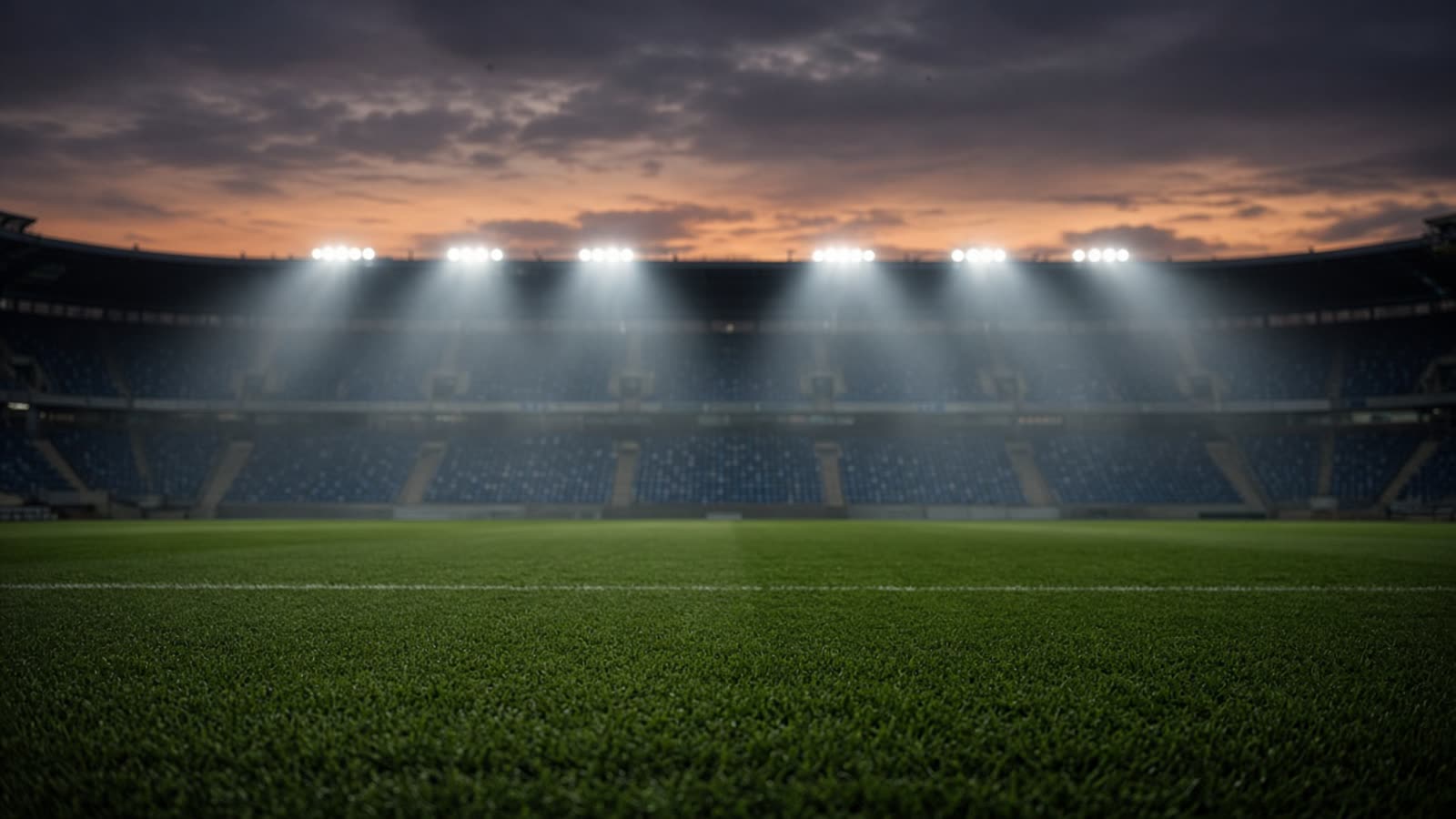 Tom fotbollsarena i skymning med strålkastarljus över planen — atmosfär efter landskamp i Nations League